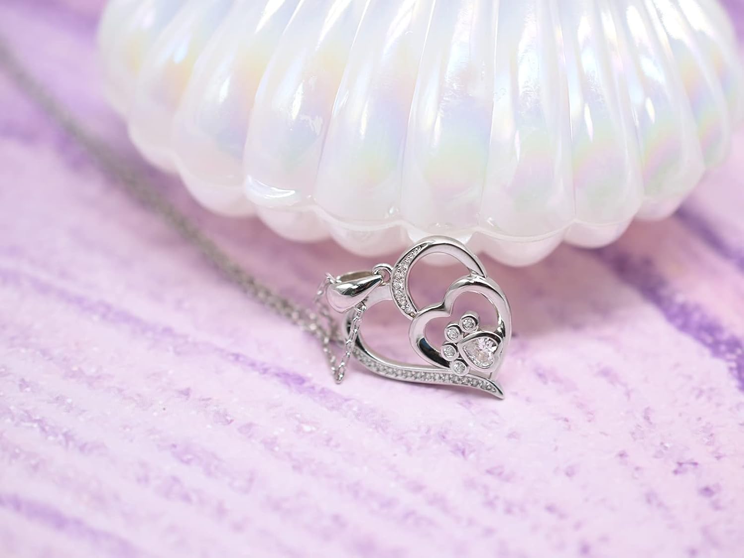Sterling silver necklace with paw and heart with cubic zirconia