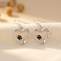 Silver pendant earrings with heart and paw design